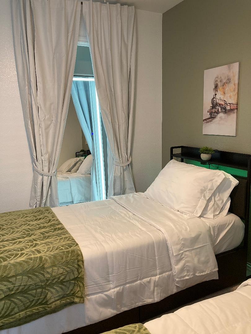 Harry Potter themed guest room for kids with smart TV, games and two twin beds.