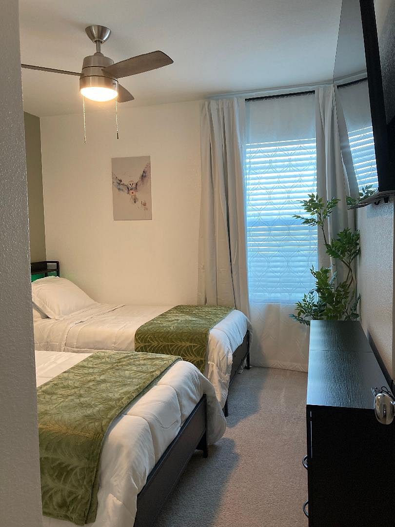Harry Potter themed guest room for kids with smart TV, games and two twin beds.