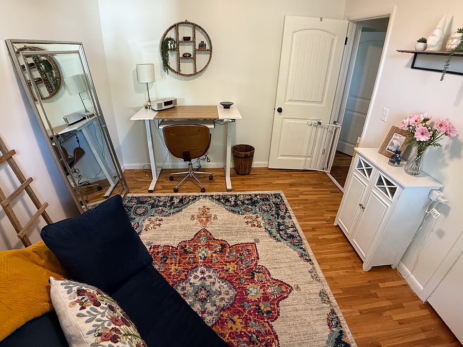 Office with adjustable electric standing desk.