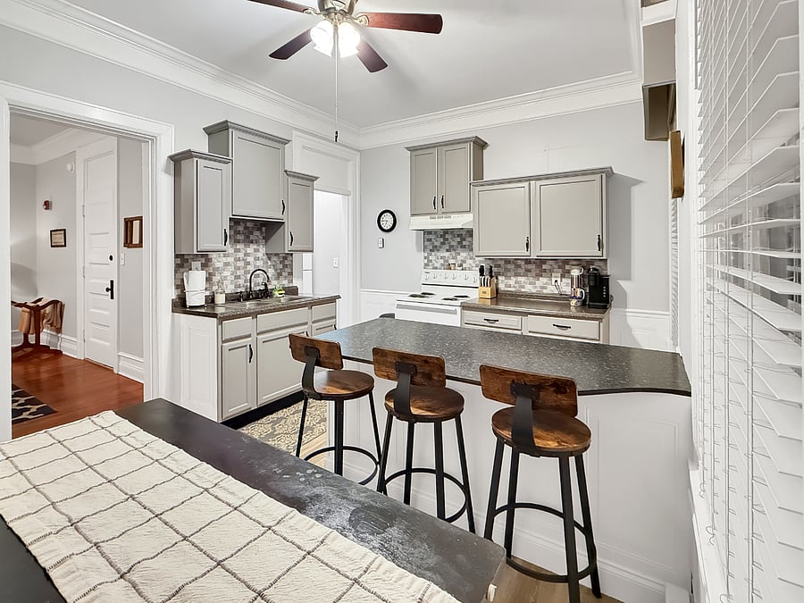 Kitchen table & island with view into living room