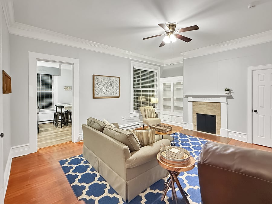 Living room with view into kitchen