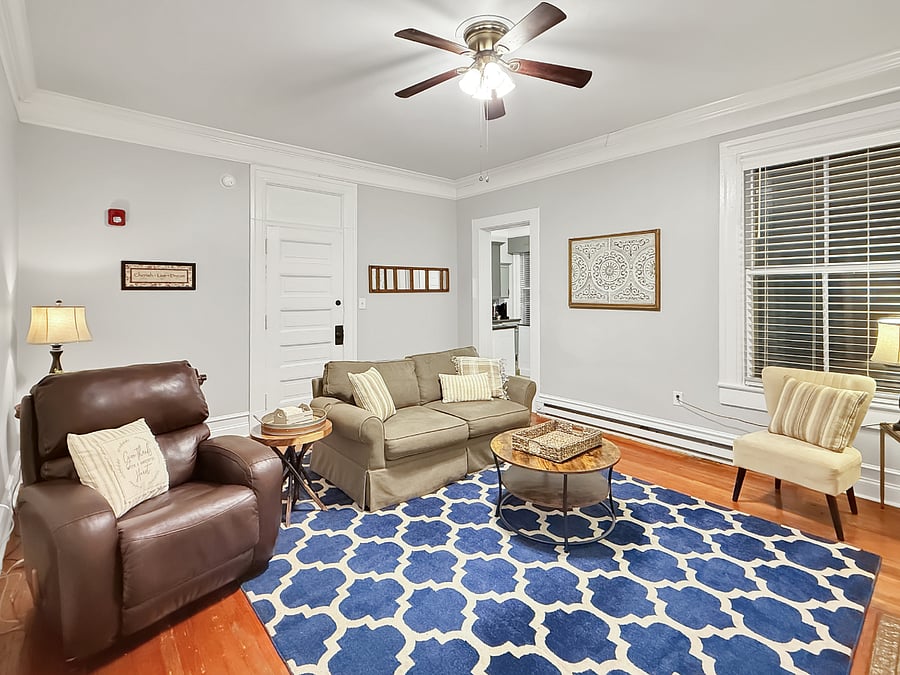 Living room with view into kitchen