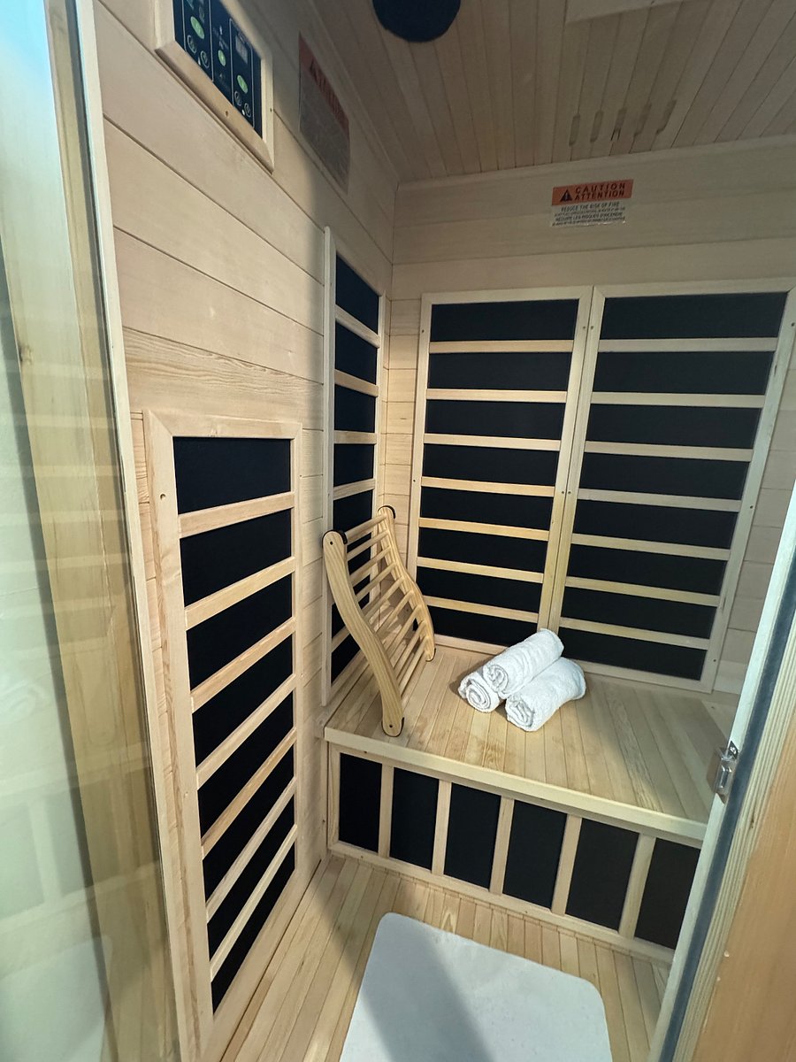 Bedroom 3: Private in-home two-person infrared sauna a rare luxury for relaxation, recovery, and wellness during your stay.