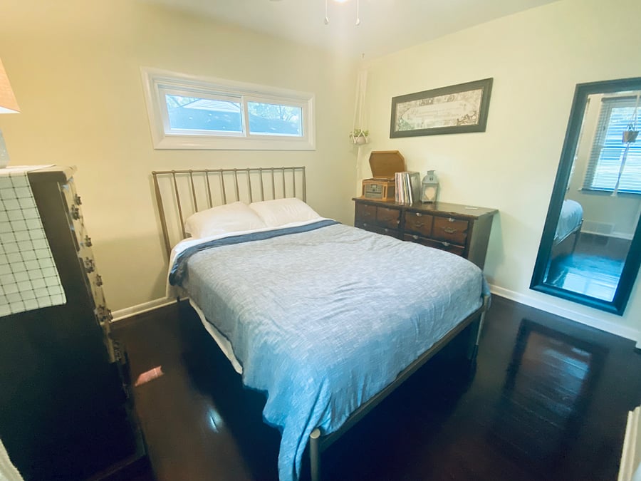Bedroom 1: Cozy, lightfilled bedroom with queen bed and plenty of space to settle in.