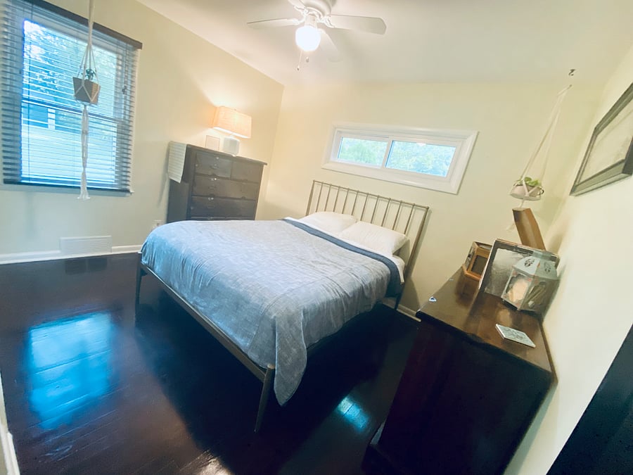 Bedroom 1: Cozy, lightfilled bedroom with queen bed and plenty of space to settle in.