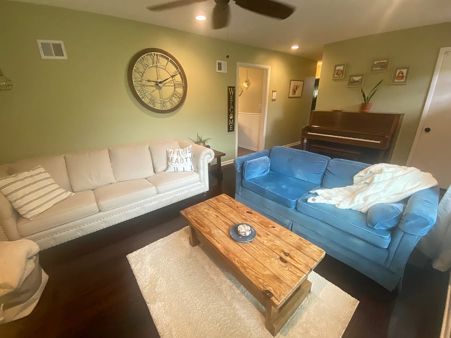 A cozy, lightfilled living room.
Featuring a 55" ROKU TV and piano.