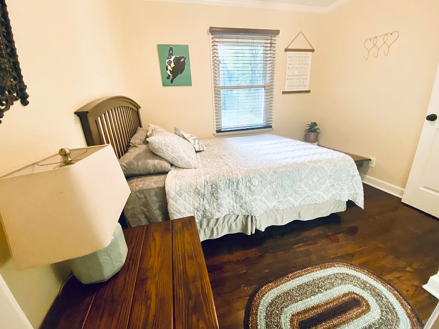 Bedroom 2: A welcoming second bedroom with a plush queen bed and large closet