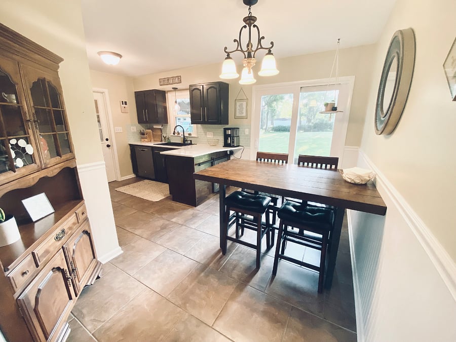 A comfortable dining area with convenient backyard accesscomfortably sits six people