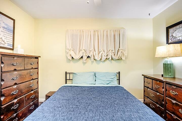 Bedroom 1: Cozy, lightfilled bedroom with queen bed and plenty of space to settle in.