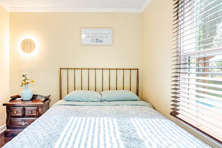 Bedroom 2: A welcoming second bedroom with a plush queen bed and large closet