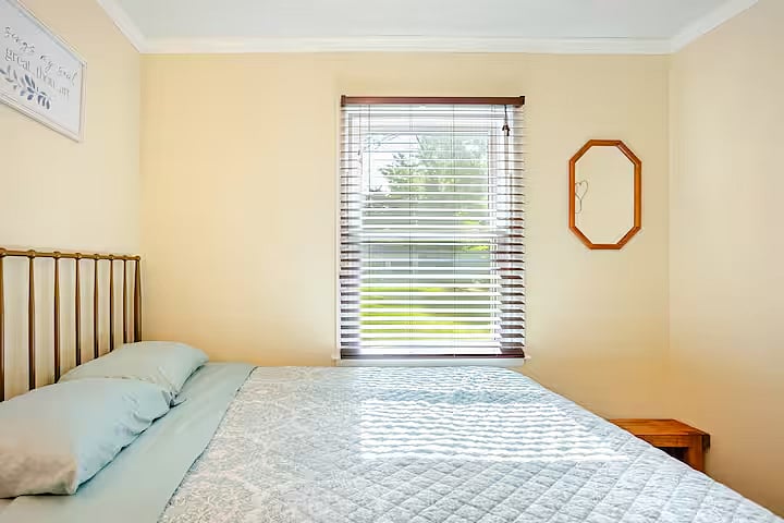 Bedroom 2: A welcoming second bedroom with a plush queen bed and large closet