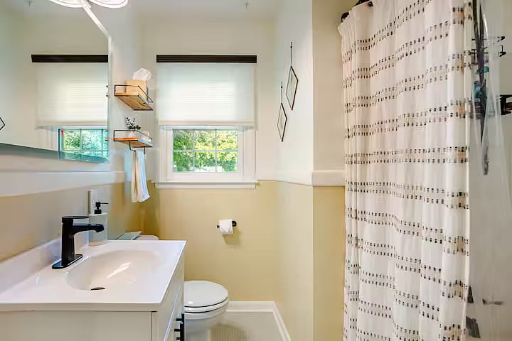 Clean, updated bathroom featuring a full tub.