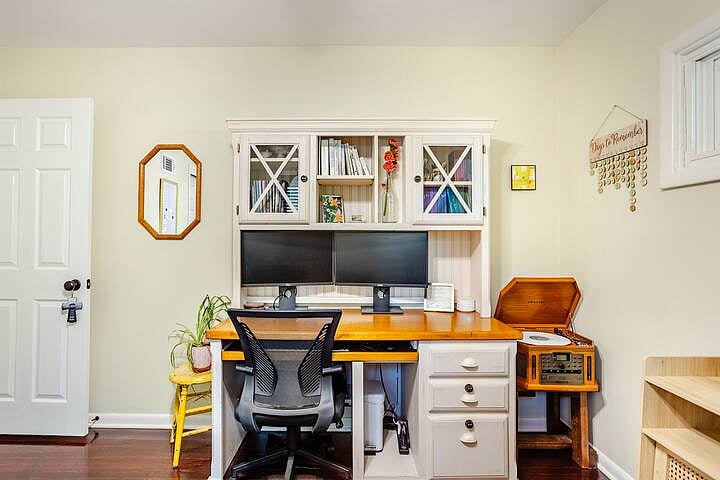 Bedroom 3: Versatile third bedroom + dedicated workspace featuring a two-person infrared sauna, spacious desk setup, and a fold-out twin bed for flexible sleeping.
