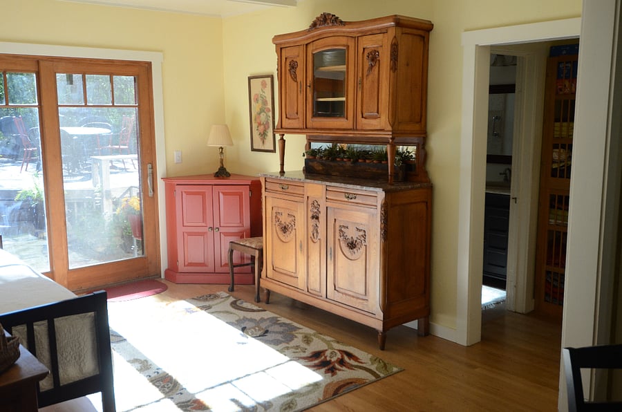 Room open to dining room with sliding door out to deck.