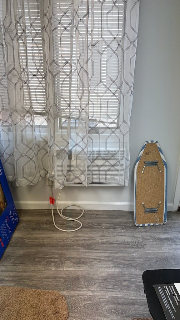 window in first room you walk into with air conditioner/heater