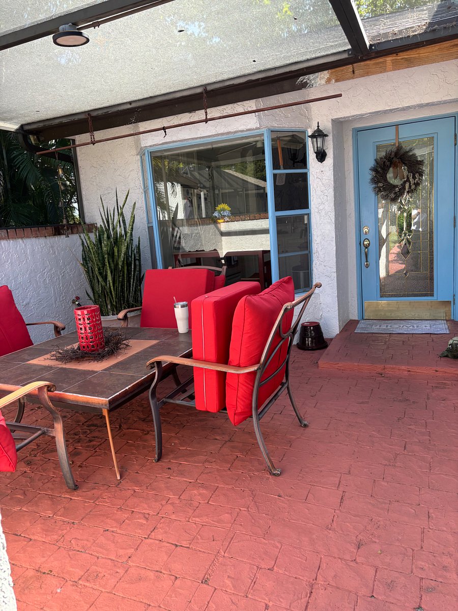 Front porch which is screened in.
