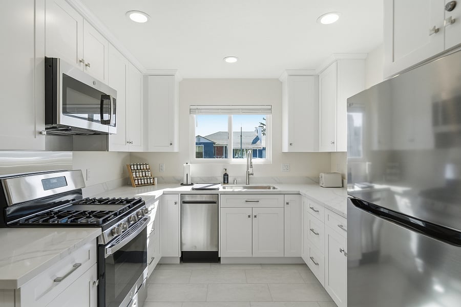 Full kitchen features brand-new appliances and comes fully stocked with essentials