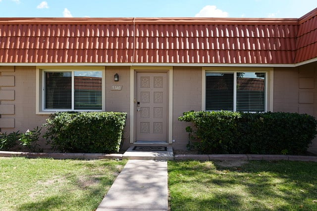 Front Door with Landscape & Concrete Walkways