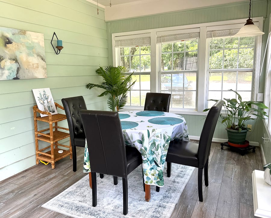 Sunny dining area brings gracious southern living indoors.