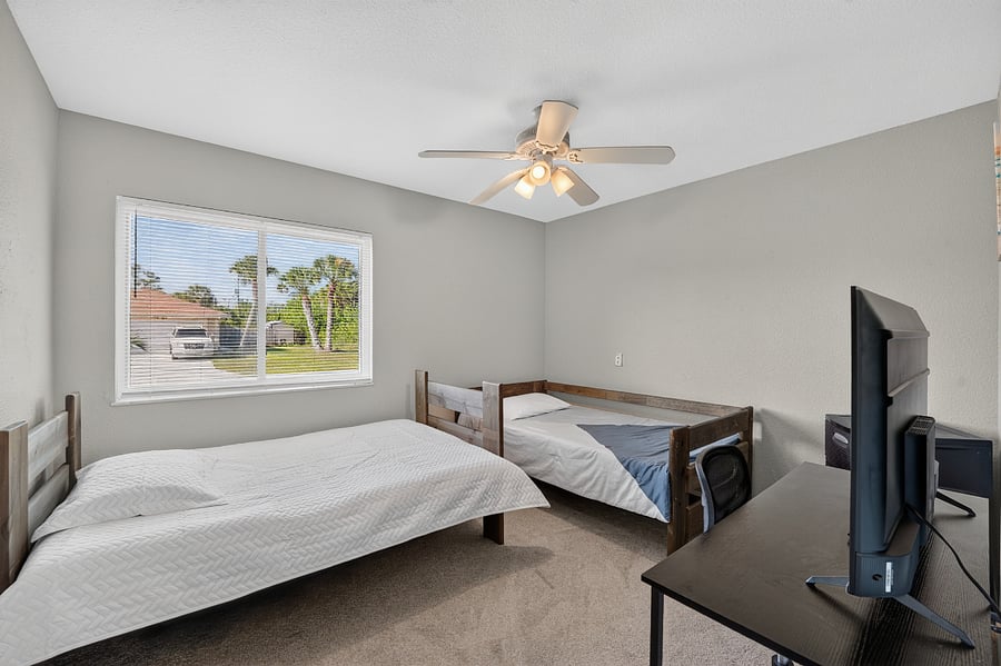 Bedroom 3  with  a  Double Bed  and  a  Twin  Bed. Desk,  Office  Chair  and  TV.