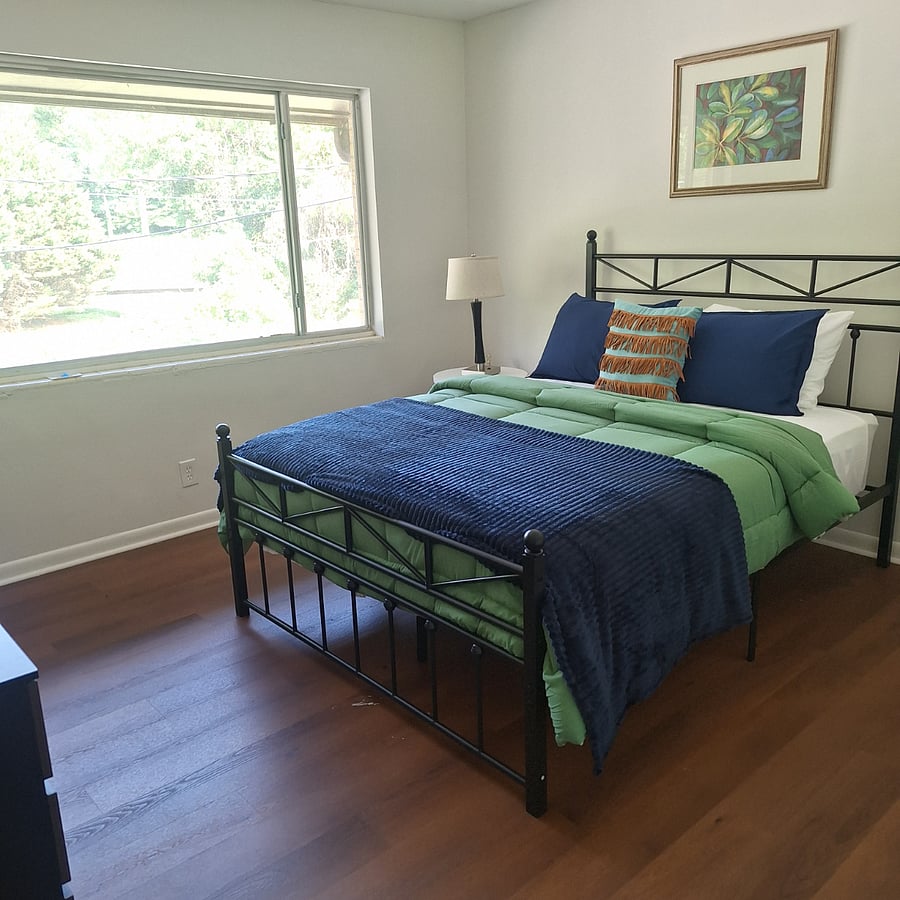 Queen bedroom with view of a creek on private golf course.