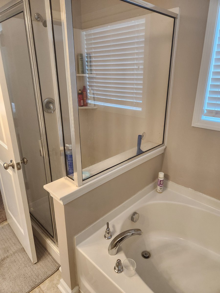 Master Bathroom Featuring a standing shower and soaking tub