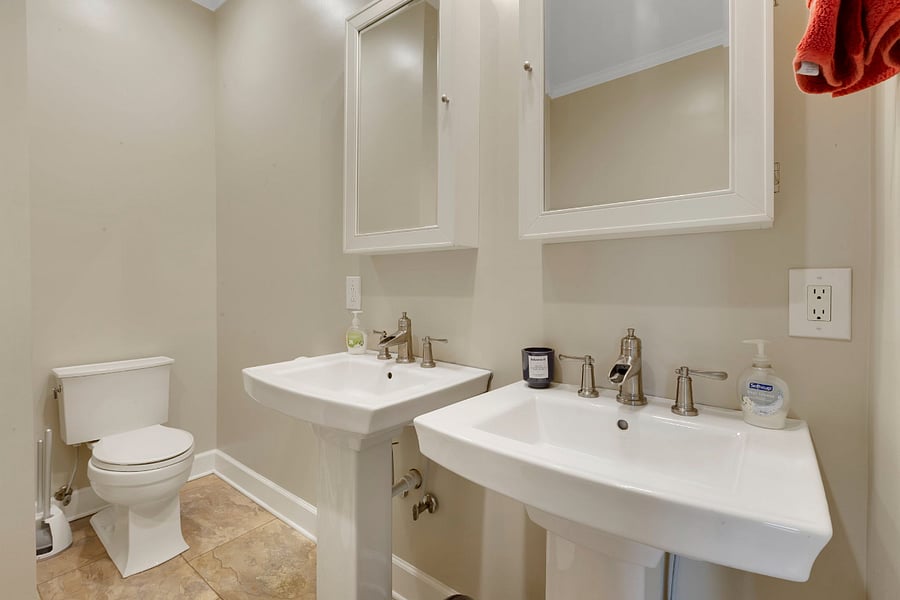 Main bathroom. Double sinks, each with their own mirrored medicine cabinet for storage. Linen closet is right across the hall (it didn't make it into any photos, but we promise it's there!).