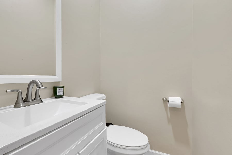 Powder room/half bath. Nothing fancy, but everything you need: just a toilet, a sink, and a little privacy!
