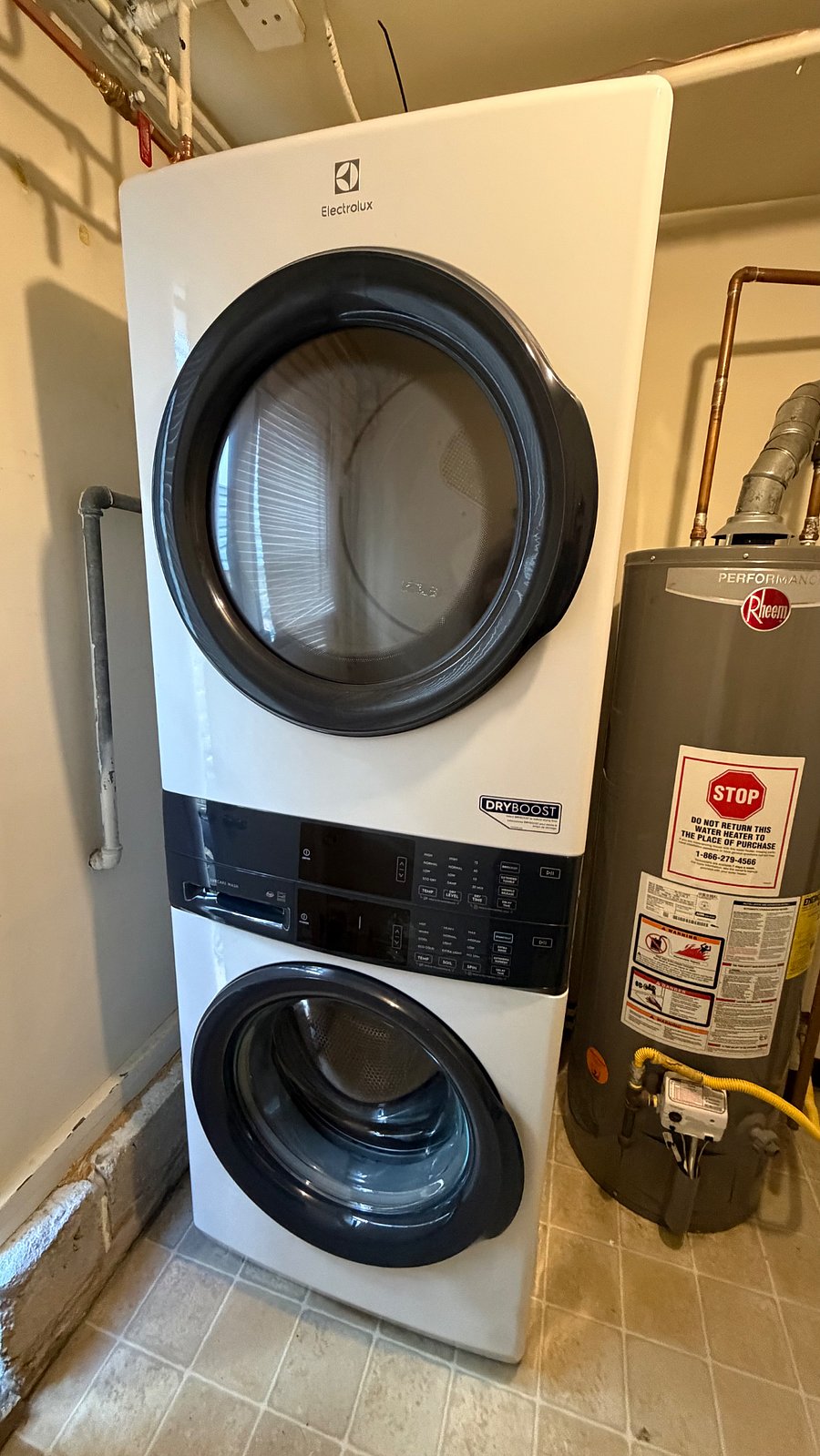 Laundry room on first floor with separate side entrance. Shared with downstairs unit. 