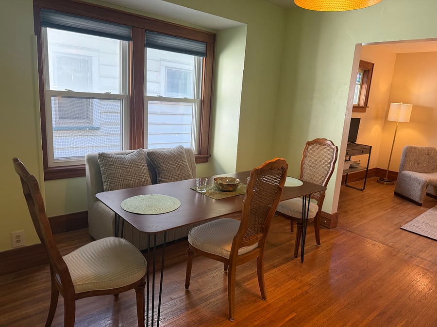 Dining room has 2 seats bench and 3 chairs. Seating for up to 6 people.