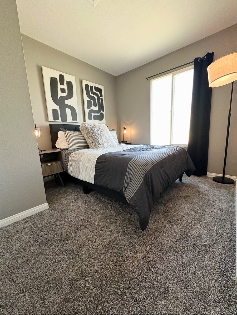 Bedroom 2 is a full-size bed, nightstands & closet.