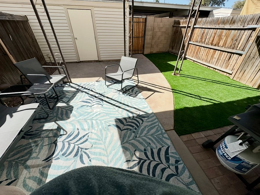 Fence backyard with covered pation, turf, BBQ, storage closet, and a gate that leads to your 2 reserved, covered parking spaces.