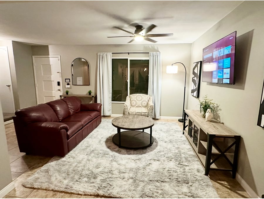 Roomy living room/ great room with large Smart TV.