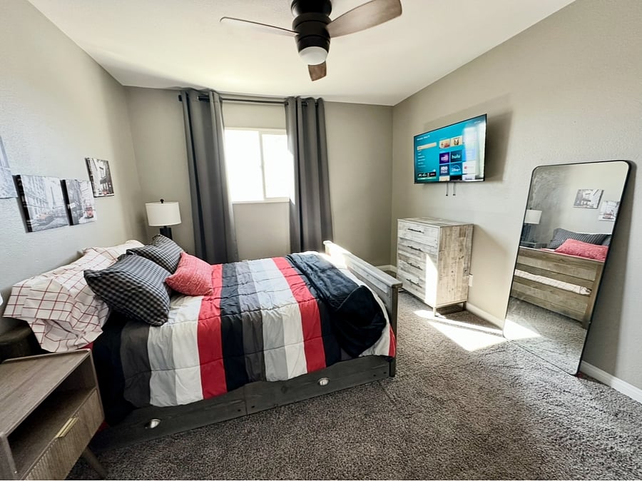 Bedroom 3 has a full-size bed PLUS twin trundle bed, dresser, nightstands, Smart TV, and closet.