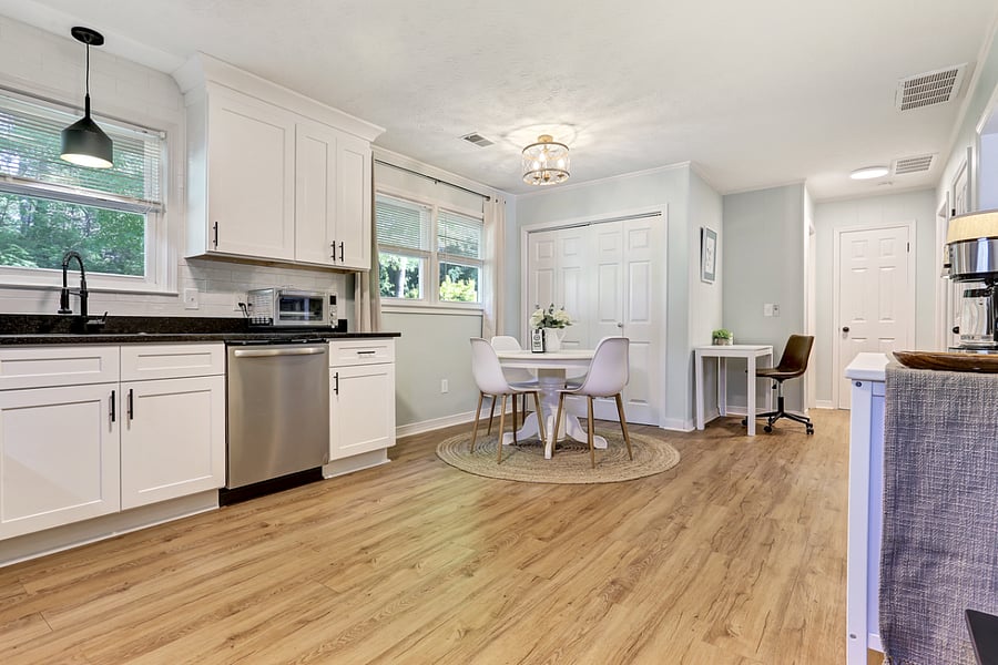 Kitchen, Dining and Office Nook. The closet doors open to the Laundry area