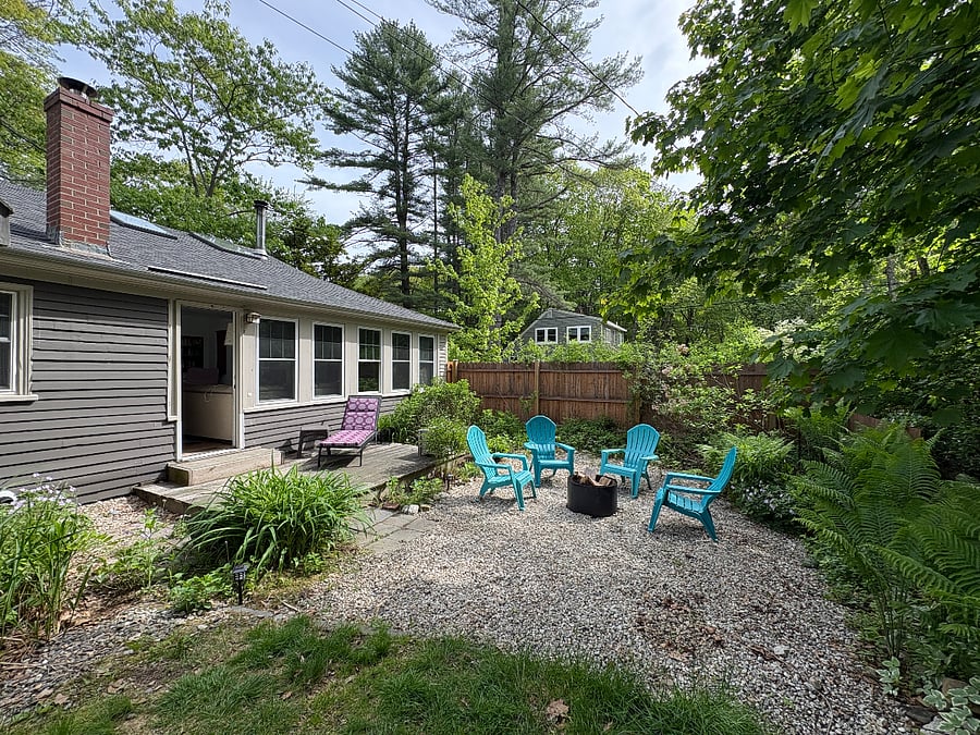 fenced back yard, small deck and firepit area