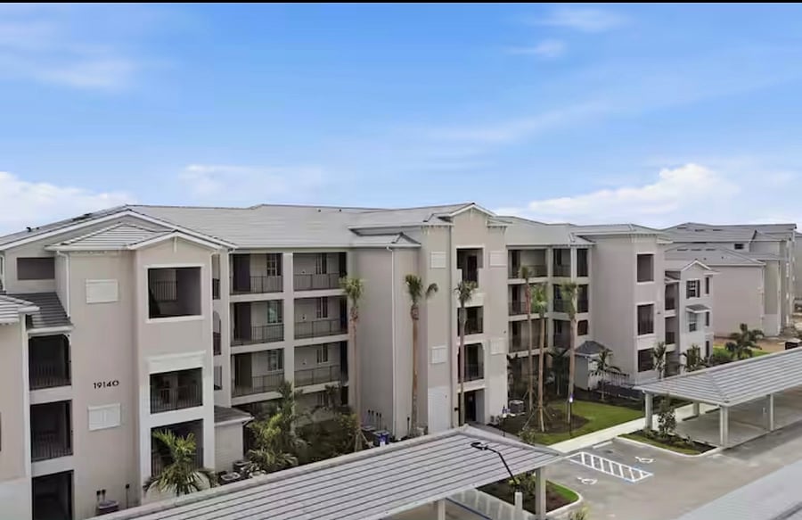 Parking lot side of the condo. You will have a covered assigned parking space, with plenty of additional parking for guests. 
