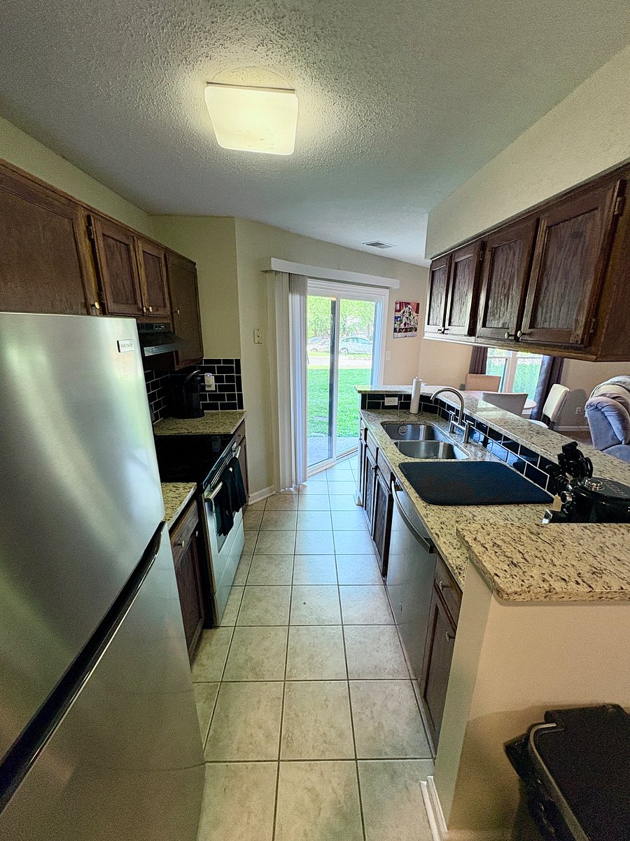 Well appointed kitchen with air fryer, keurig coffee machine , blender, mixer, toaster, and brand new microwave.