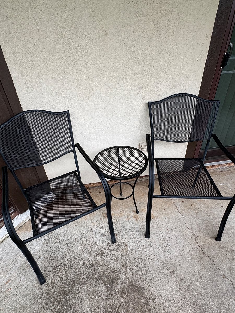 1 of 2 outside patio spaces.  One in the front and one on the side.  Both have seating and side tables.