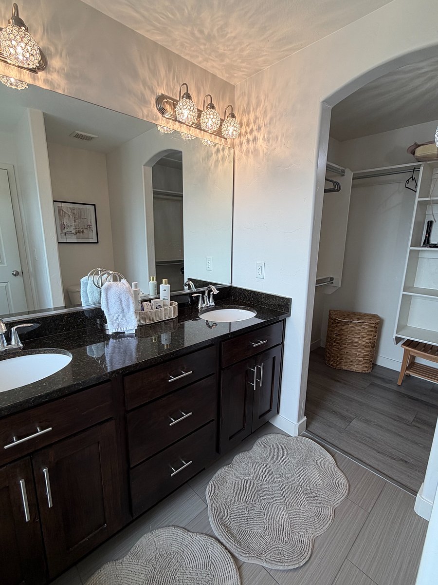 Dual-vanity ensuite with generous storage and walk-in closet access