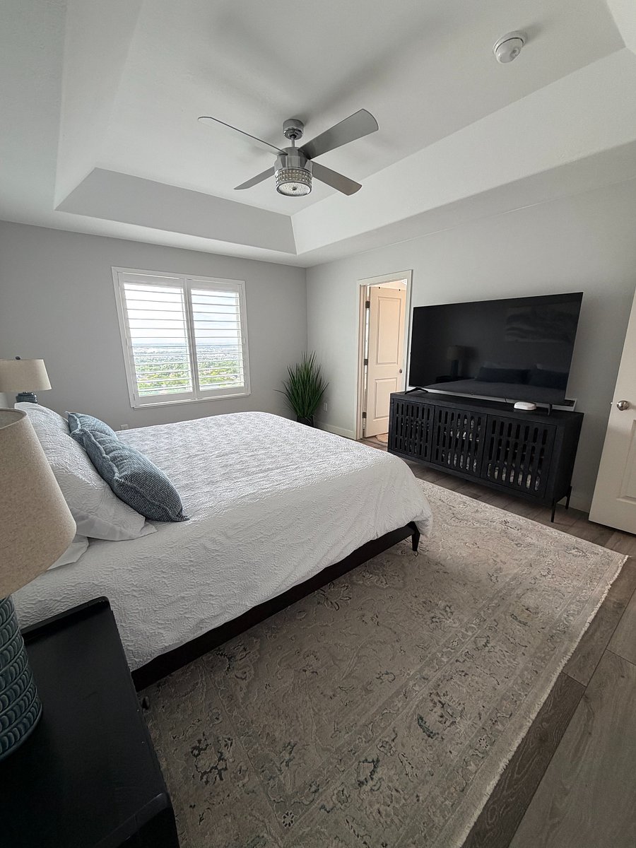 Primary suite with king bed, 65' smart TV and en-suite bath.