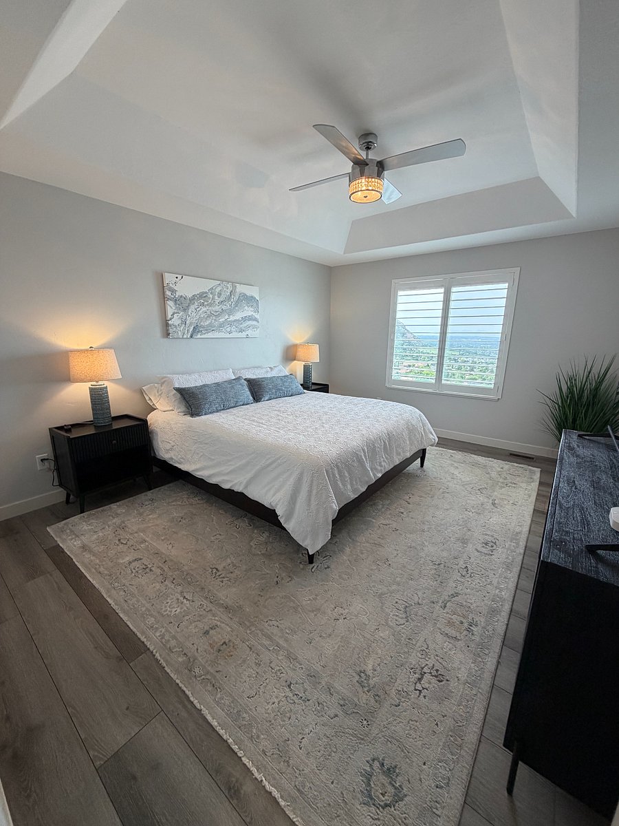Comfortable primary retreat with tray ceiling and valley views.