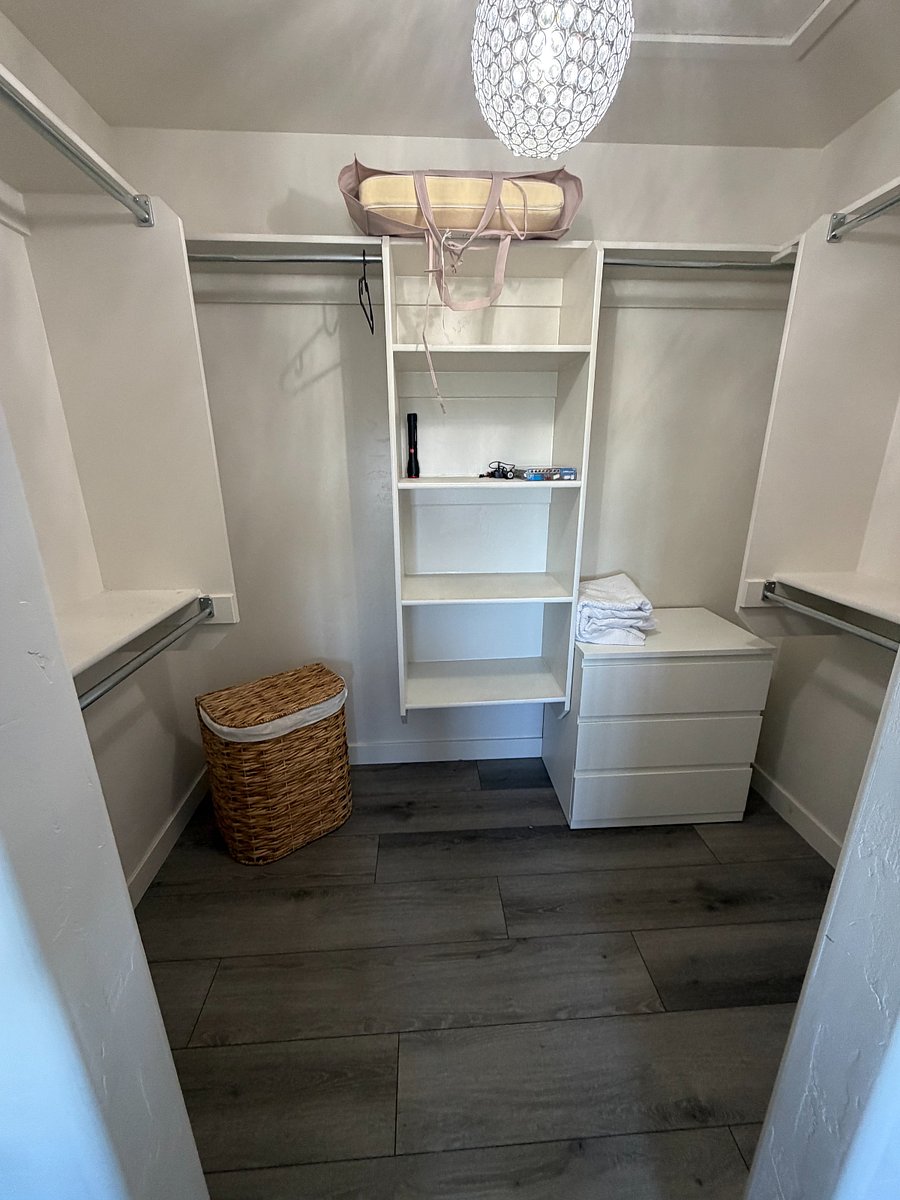 Walk-in closet with abundant hanging and storage space.