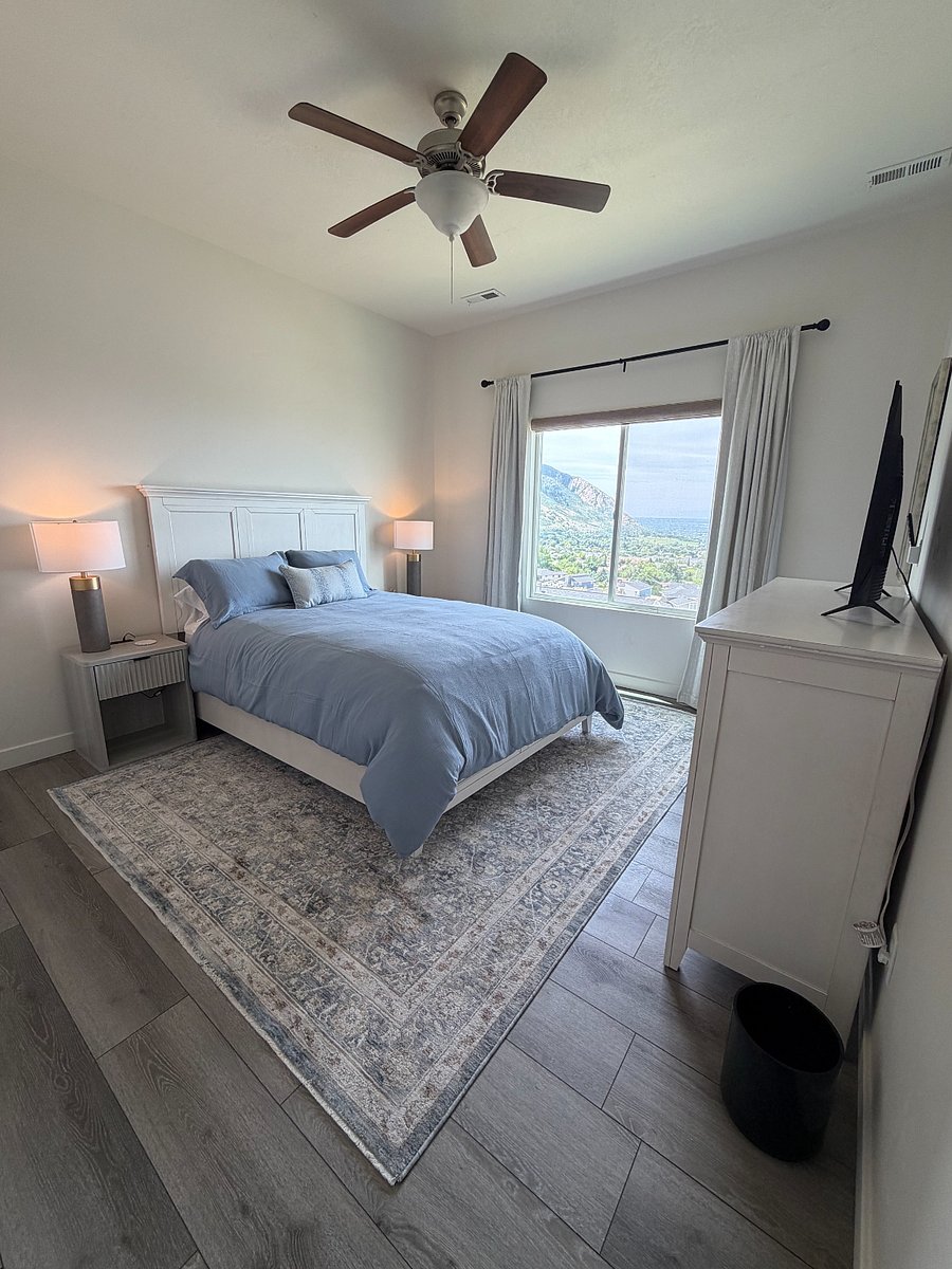 Bedroom 4 - Private lower-level bedroom with queen bed, smart TV, and valley views.