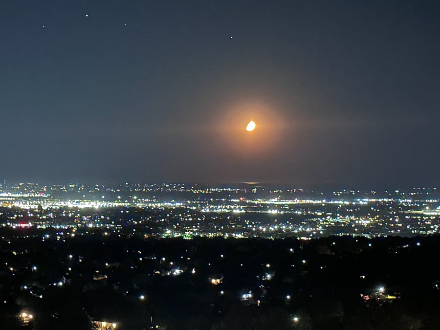 When darkness descends, the entire valley below comes alive with sparkling lights in one of the property's most unforgettable views.