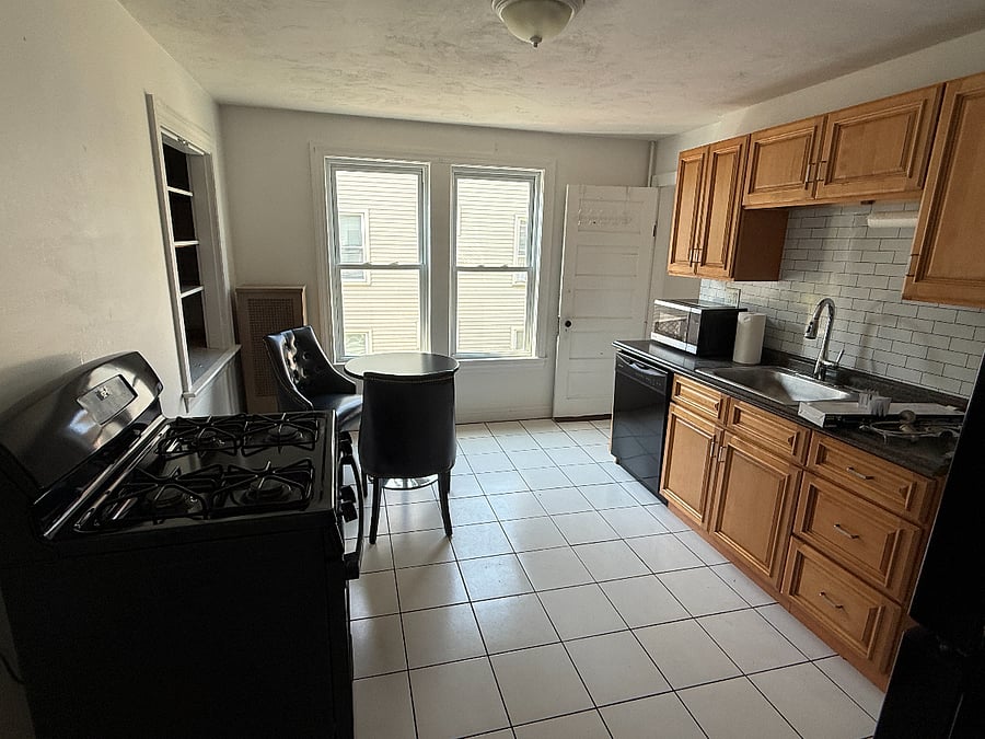 Kitchen with dishwasher, new blinds going up after the holiday.