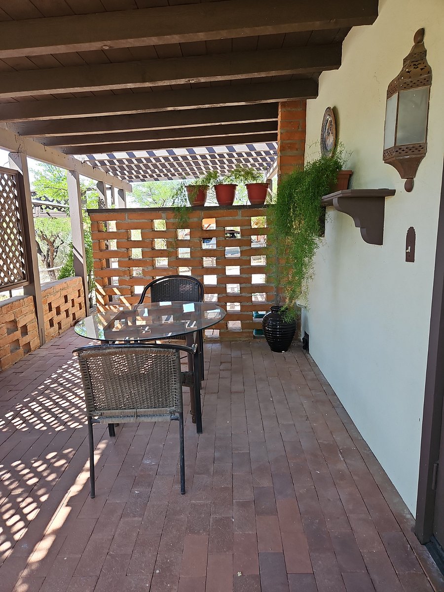 Front patio off main entrance with gas grill.  Secure washer dryer/utility room off this patio.