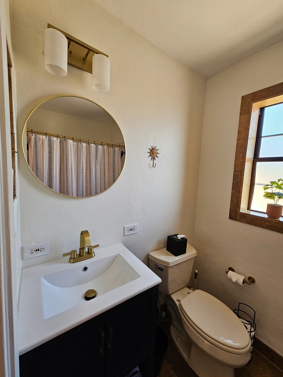 Ensuite bathroom with tub/shower combo.