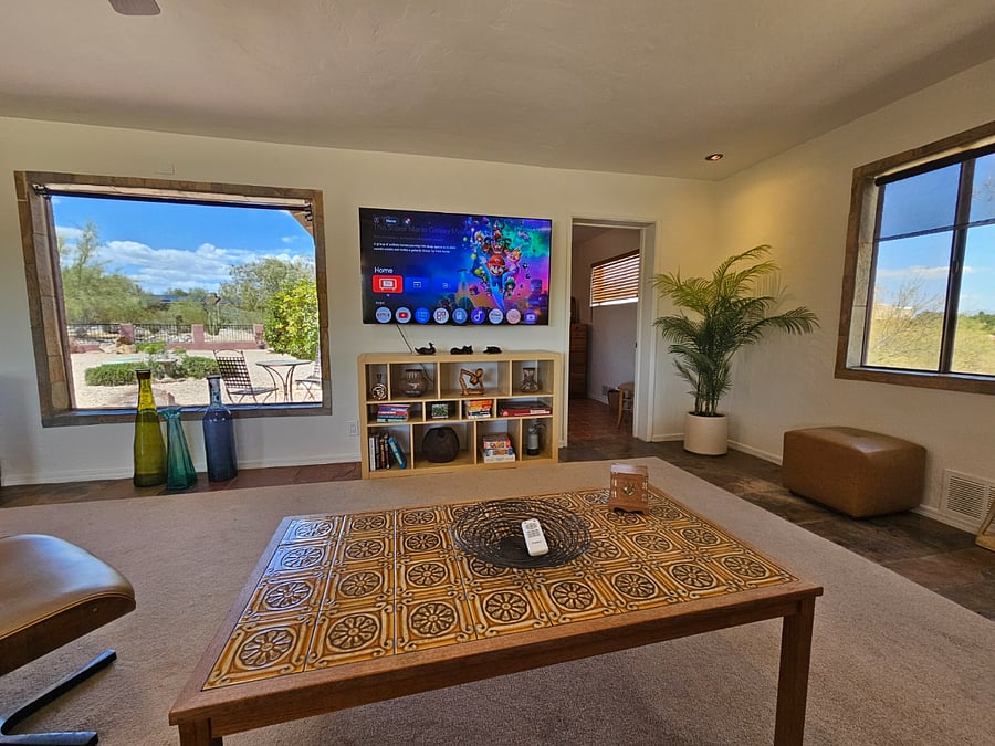 65" Smart TV. Entry to 2nd bedroom provides split floorplan.