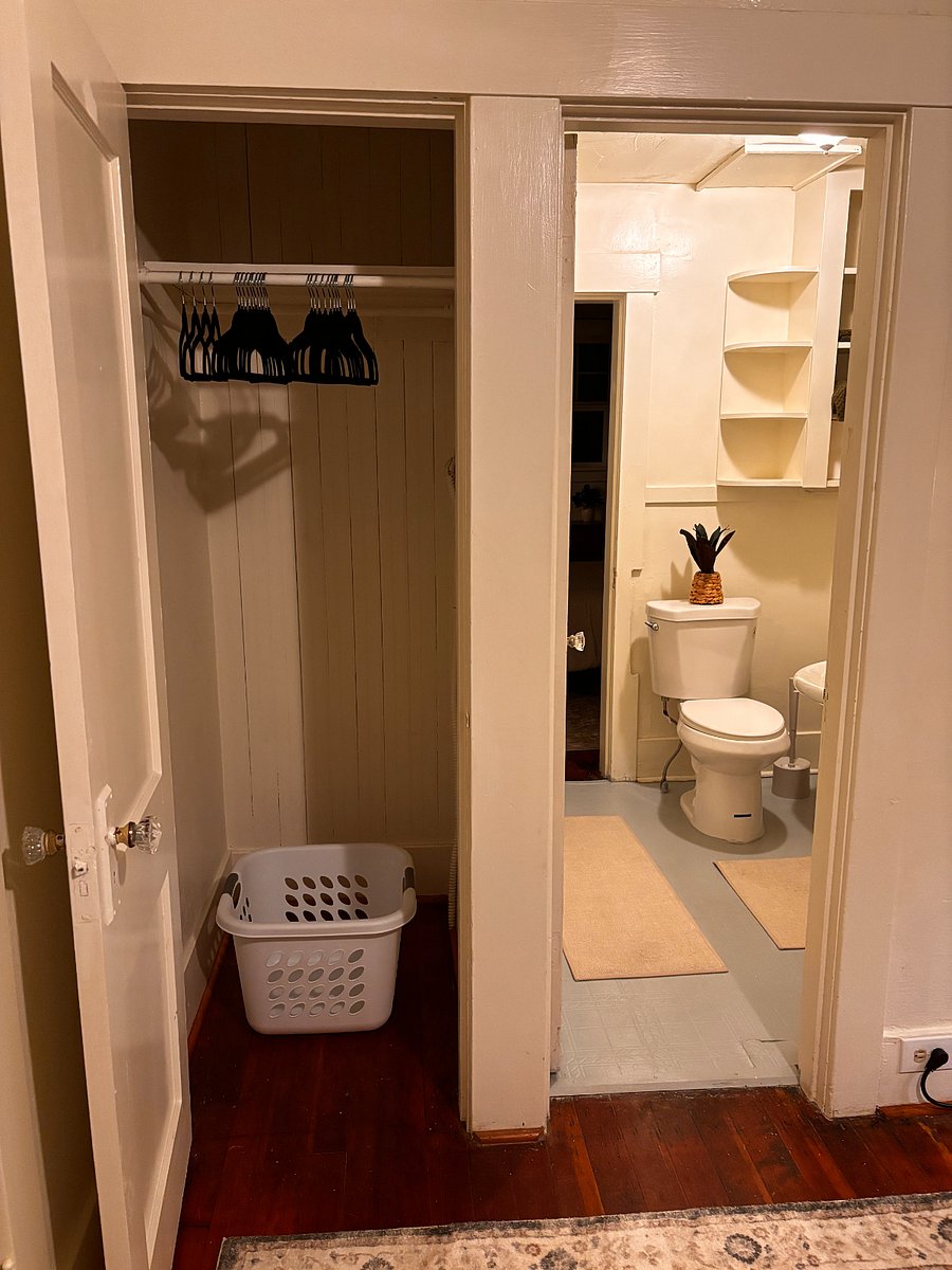 Both bedrooms include a spacious closet with hangers and laundry basket, perfect for extended stays.